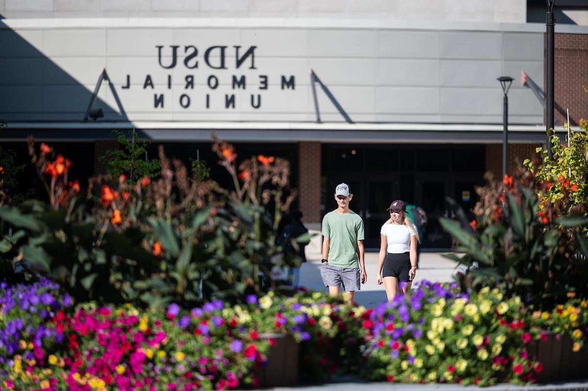 Photo of students walking on campus